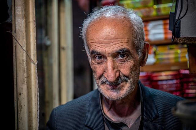 This is Junis, a nice fellow we‘ve met in the beautiful bazar of Tabriz. He is running a tiny tea shop there since he retired from his regular job 17 years ago. He found it boring to just sit at home and he told us it was also better for his marriage to do something rather than staying home all the time. He enjoys being with people and on some days he has 250-300 customers. Many of them are shop-owners and regulars. For us it was one of these encounters which make traveling in Iran so worthwhile - and we had some excellent tea! So don‘t miss to have a chat and a tea with Junis if you come the bazar in Tabriz. 
#tabriz #bazar #teashop #teashops #iranvisitorsclicks #irantravel #irantours #iran🇮🇷 #travelphotographer #travelphotooftheday #travelphotograpy #reisefotografie #angelbirdmedia #angelbirdcreatives #portraitmood #portraits_ig #documentaryphotographer #peopleareawesome #people_infinity #people_and_world #people_vs_camera #people_infinity_ #peopleoftheworld #thepeoplewemet #wonderfulencounters #kings_third_age Thanks to @she_leaders_by_heike_berger @heikeberger12 for the 3rd photo!